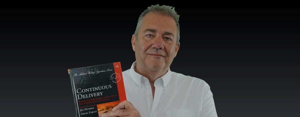 Dave Farley holding Continuous Delivery book