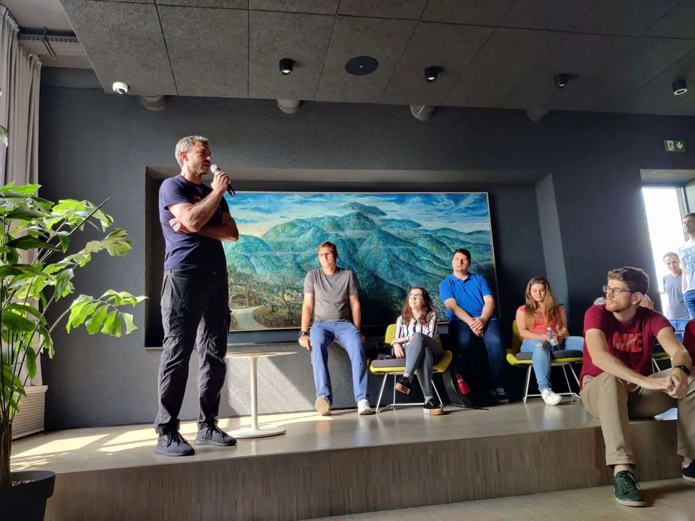A CROZ colleague presenting to the team at an all-hands meeting