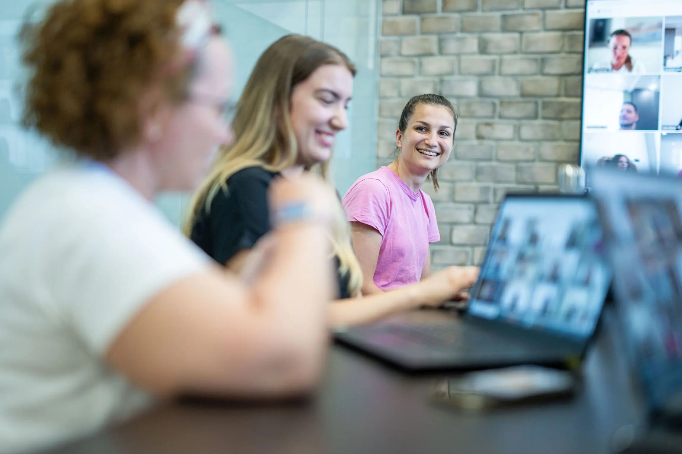 CROZ colleagues on a video call with remote teammates